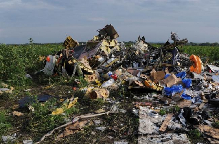 France, U.K. trade hypocrisy claims over MH17 sanctions, analysts say