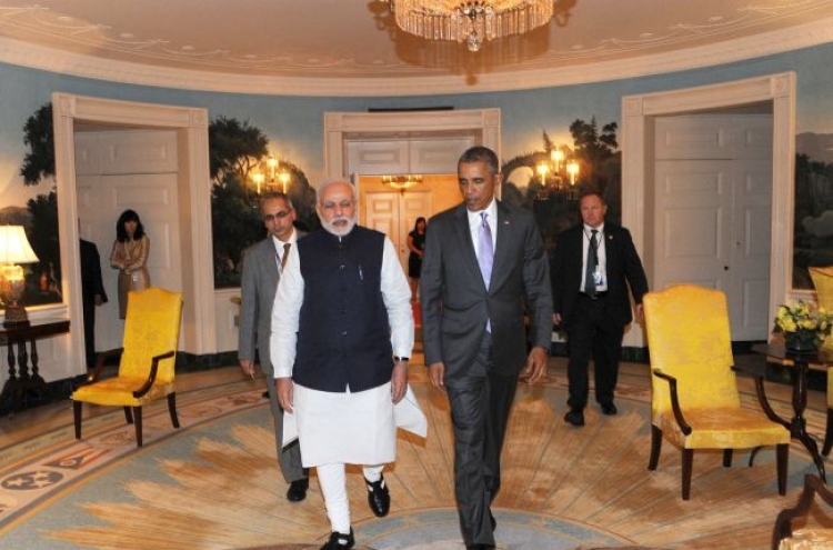 Obama, Modi put upbeat face on ties