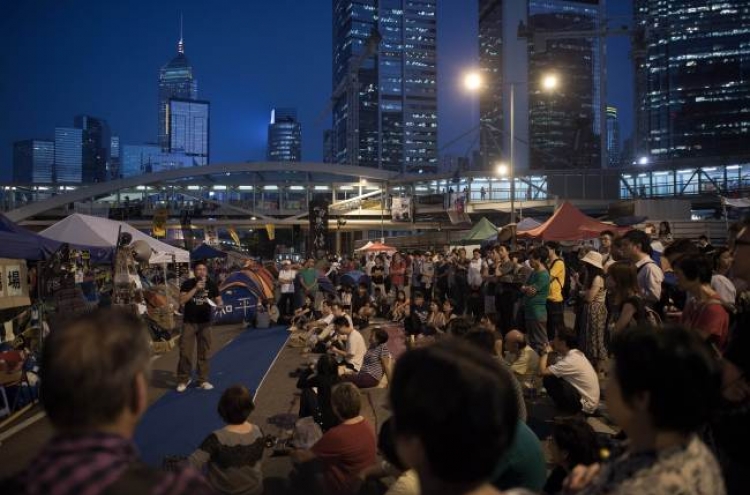 Hong Kong leader says poor would dominate free vote