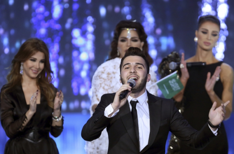 Syrian wins Arab song contest, keeps clear of politics