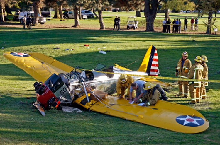 Harrison Ford survives crash-landing on golf course