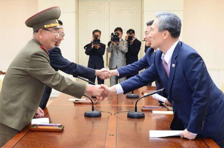 Two Koreas reach deal to ease military tensions