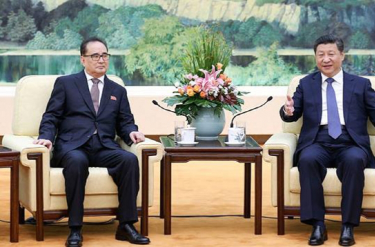 Leaders of N. Korea, China voice hope to mend ties