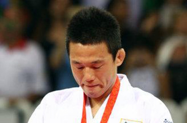 Former world judo champ Wang Ki-chun to retire
