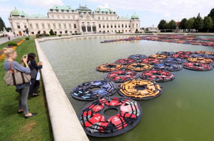 Ai Weiwei’s refugee life jackets in Vienna palace pond