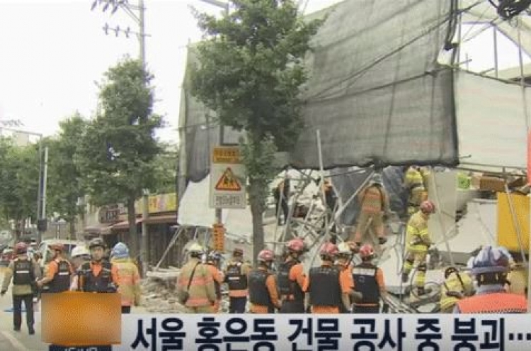 One person buried under collapsed building: report
