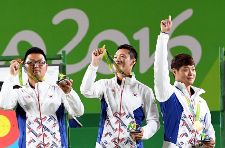 20-something friends team up for 1st Olympic gold in archery