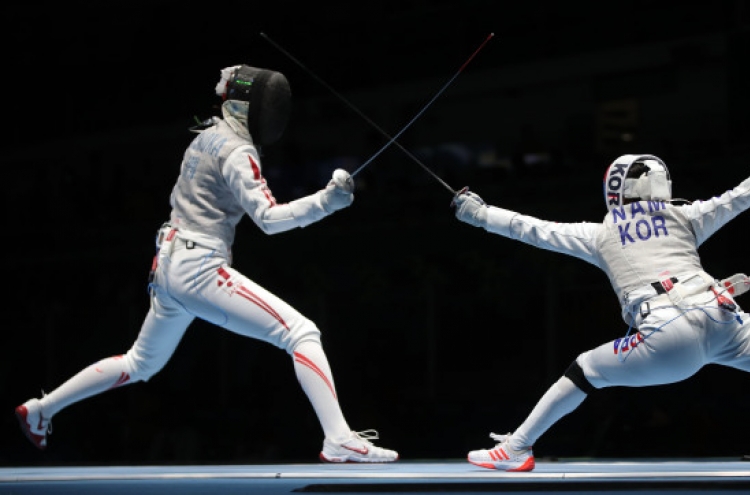 Former Olympic medalist takes early exit in foil fencing