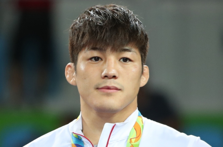 Korean wrestler Kim Hyeon-woo overcomes judging controversy to win bronze