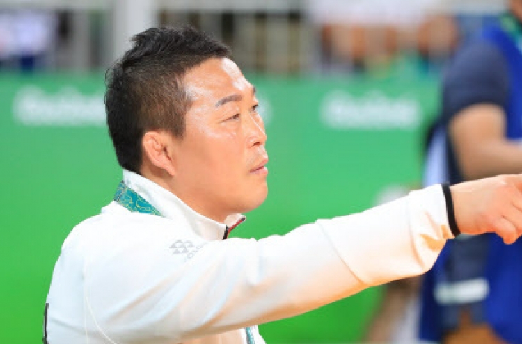 Banned Korean wrestling coach permitted back in seat