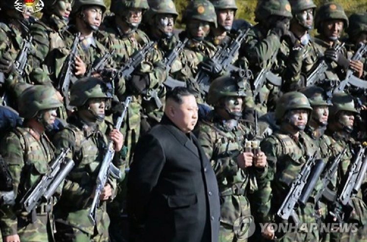 N. Korean leader using group photos to show off his hold on power: observers