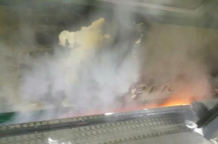 Seoul subway train catches fire