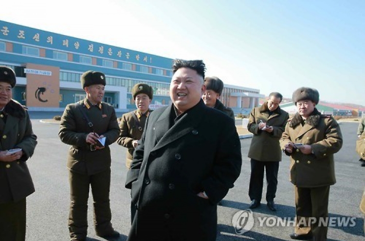 NK leader smiles during inspection of catfish farm following brother's death