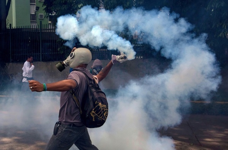 Boy, woman killed in Venezuela mass protests
