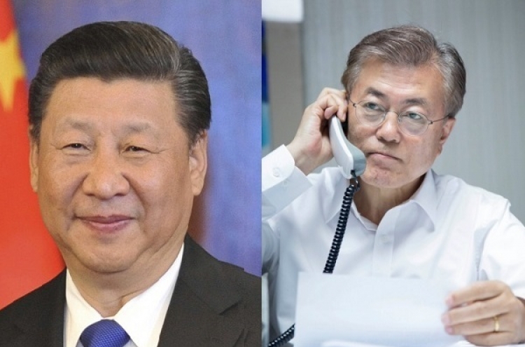 Moon and China's Xi agree to improve ties, denuclearize N. Korea
