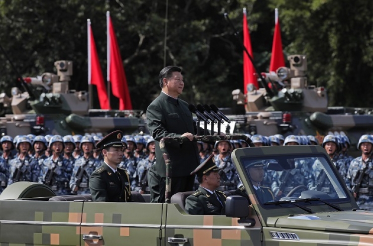 Massive military parade for Xi as Hong Kong activists freed