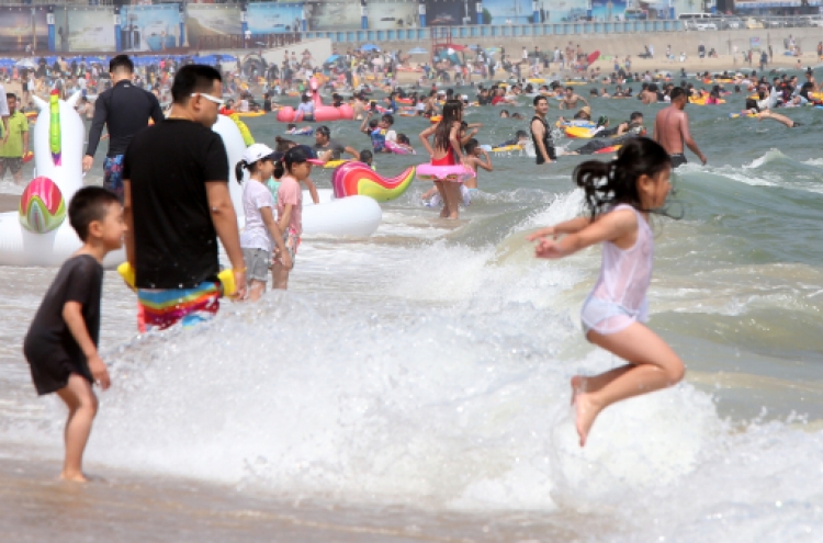 Sluggish economy means no summer holiday for 1 in 5 Koreans