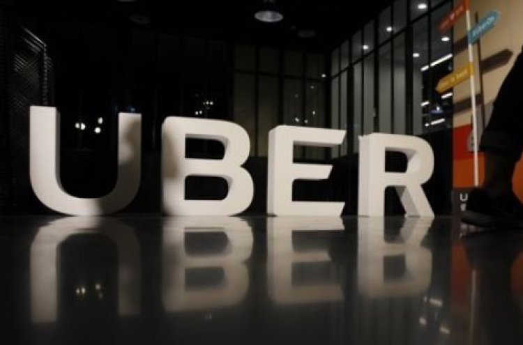 Uber, KB Financial team up for food delivery service in Korea