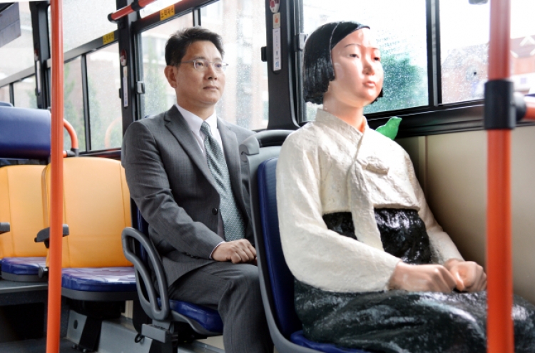 [Herald Interview] How comfort women statues got to ride Seoul buses