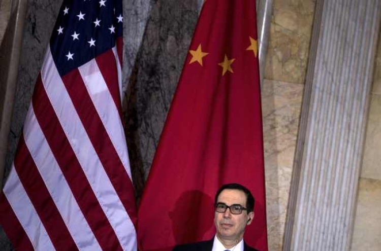 China urges US to drop new sanctions on Chinese companies