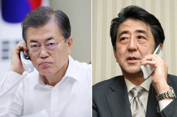 Moon, Abe agree to peaceful solution to North Korea’s provocations