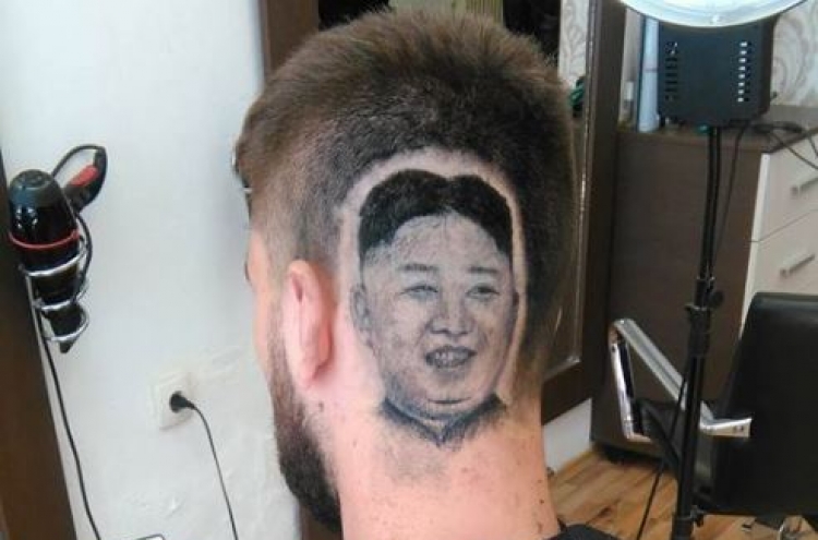 Serbian man shaves his head to enshrine N. Korean leader’s portrait