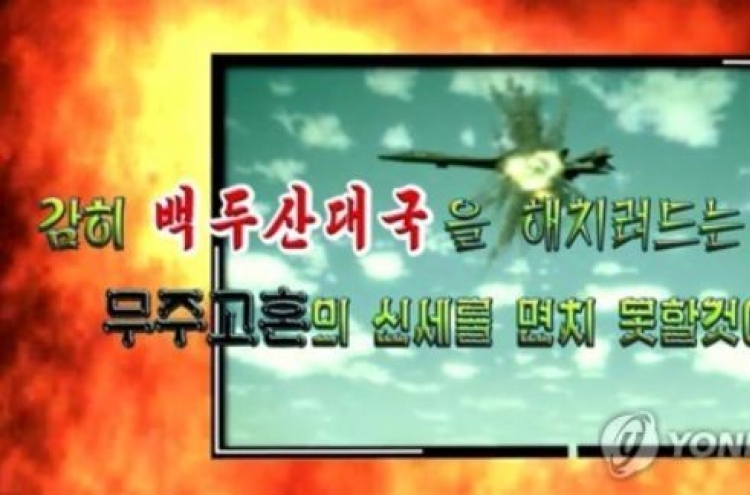 N. Korea releases propaganda photos of US bomber, supercarrier under attack