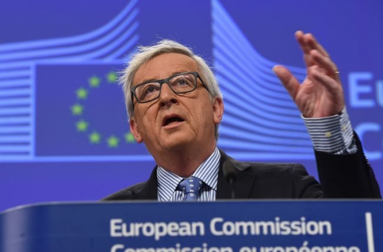 Juncker urges strong German government after Merkel vote wobble