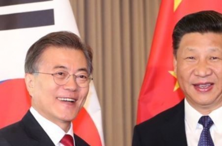 Moon, Xi to hold bilateral summit, normalize ties soured by THAAD