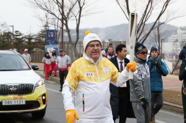 [PyeongChang 2018] IOC President Bach carries torch for PyeongChang on day of opening ceremony