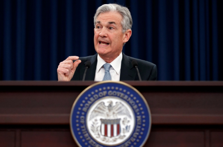 Fed leaves rates unchanged, says inflation close to target