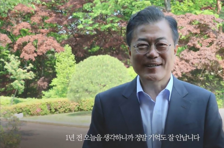 Moon quietly marks first year in office