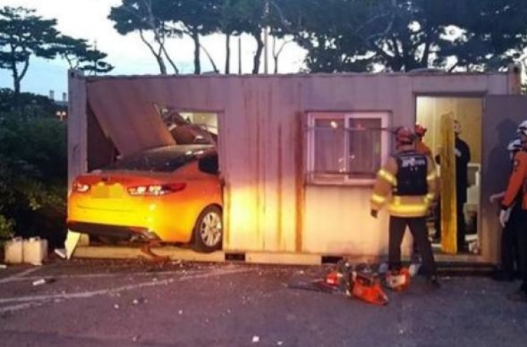 Taxi drives into Incheon Airport parking lot container
