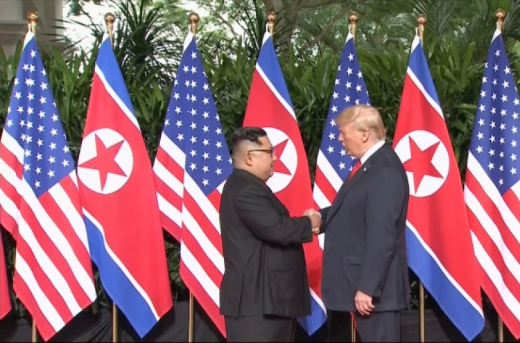 [US-NK Summit] Trump, Kim shake hands to open momentous summit