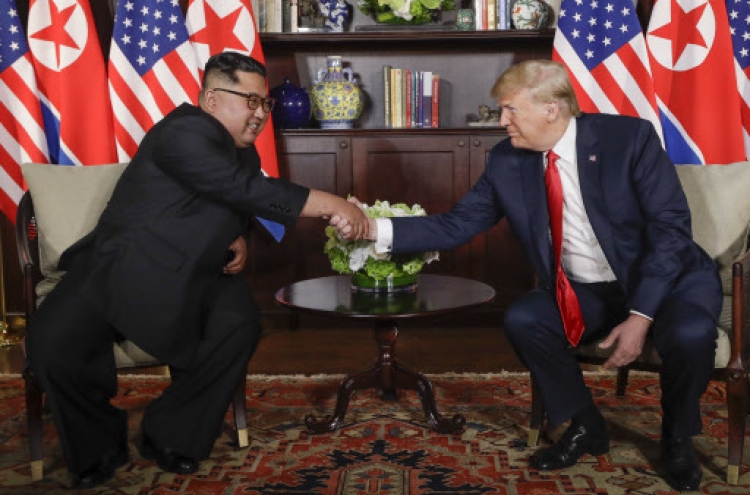[US-NK Summit] Trump, Kim shakes hands, enter talks