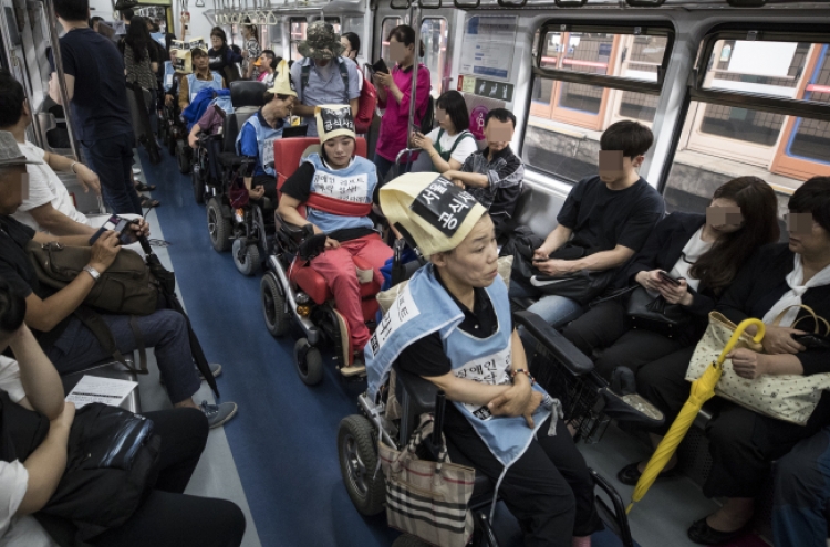 The disabled fight for right of mobility on Seoul subways