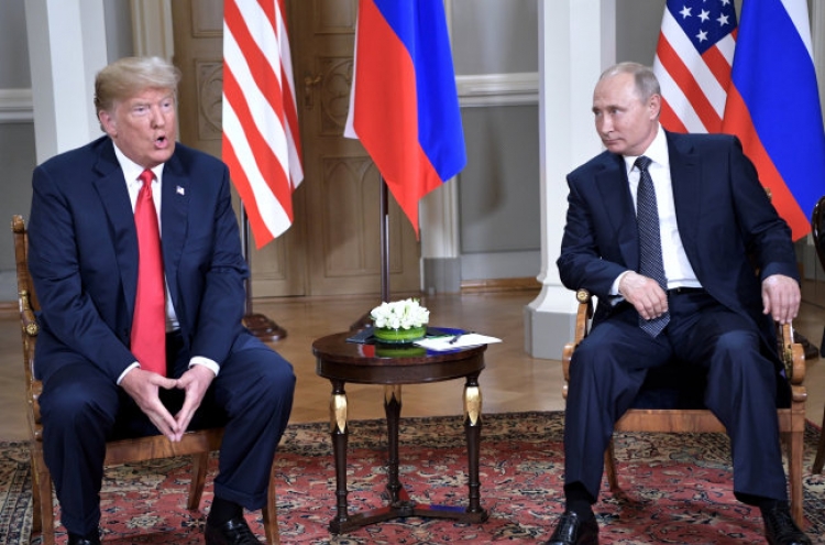Trump, Putin sit down a bit late for closely watched summit