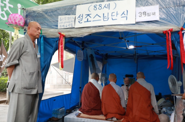 Scandal-laden chief of Korea's biggest Buddhist sect facing calls for resignation