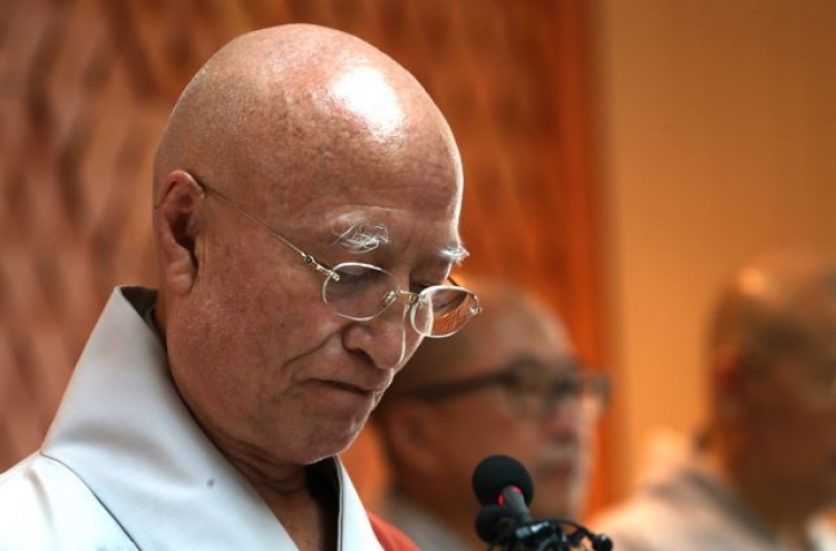 Buddhist leader resigns over corruption allegations
