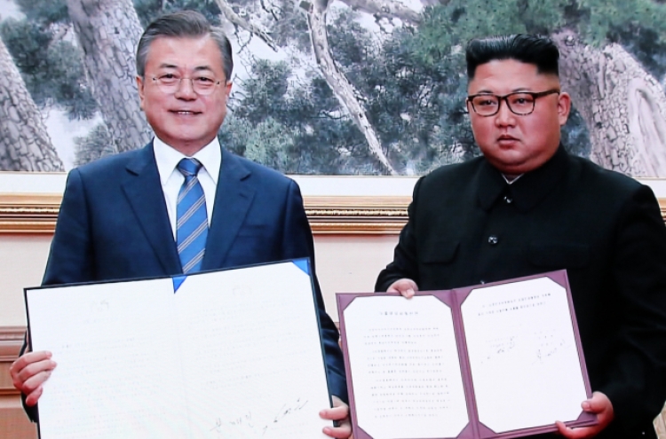 Kim vows to visit Seoul, dismantle nuke, missile sites