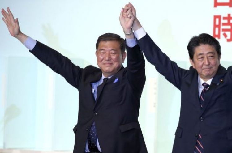 Japan’s Abe re-elected as party head, to stay on as PM
