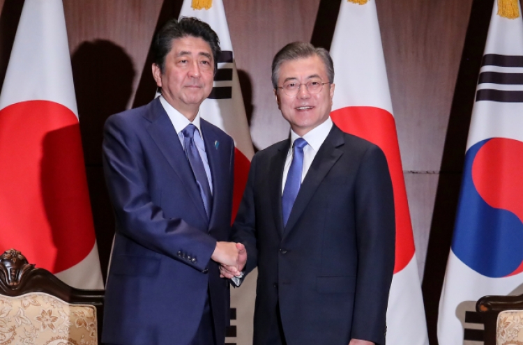 Leaders of S. Korea, Japan hold summit on bilateral ties, N. Korea