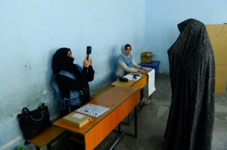 Afghan polling centres plagued by problems as casualties surge