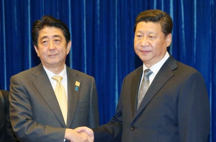 Japan's Abe in China as two nations try to mend ties