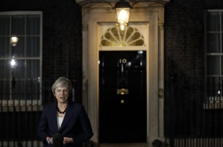 May wins Cabinet backing for Brexit deal but pitfalls remain