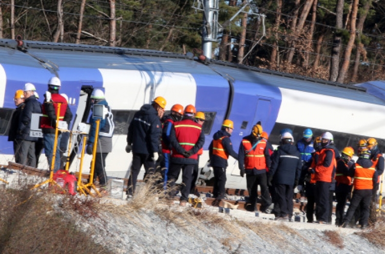 Recovery work continues on derailed KTX train site amid cold weather