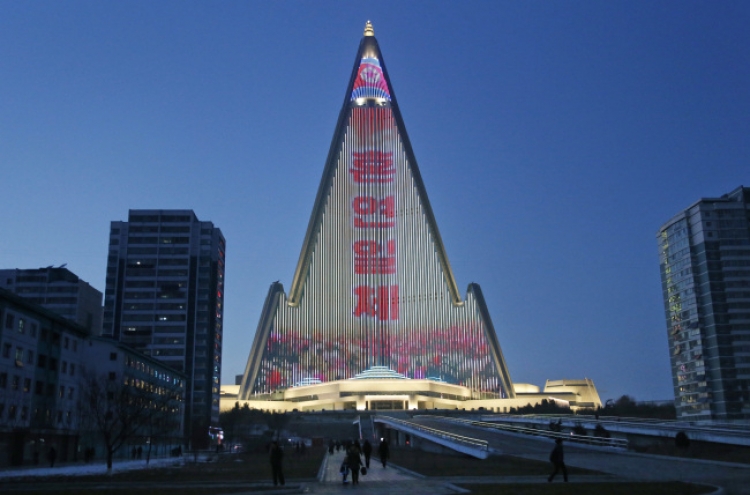 World's tallest empty hotel lit up with N. Korean propaganda