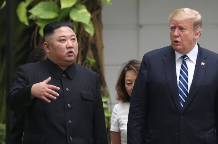 Kim, Trump seen strolling on hotel grounds