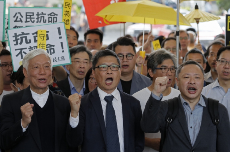 Hong Kong democracy leaders await Umbrella Movement verdict