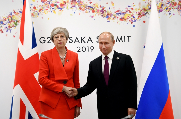 May to Putin: Stop 'destabilising' UK, allies